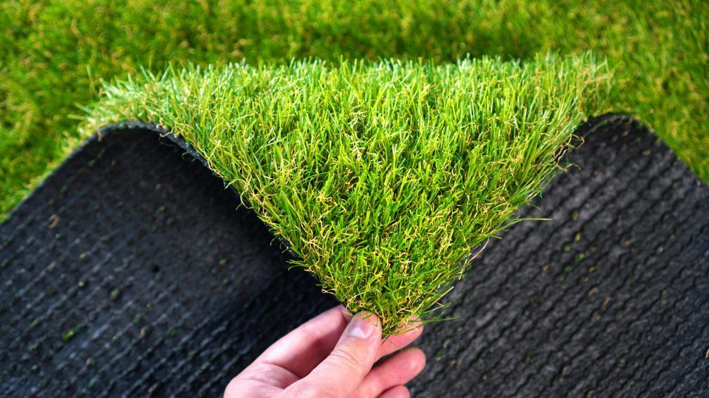The backing of artificial or synthetic grass